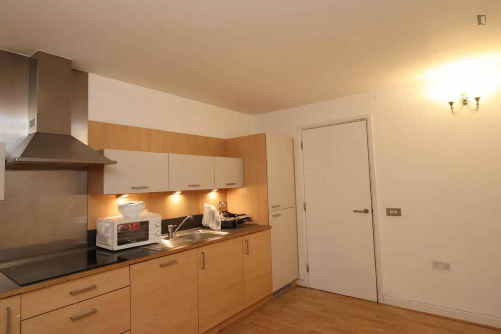 Room in a 3 Bedroom Apartment, John Harrison Way, London, SE10 0BL - London, England, United Kingdom - Bedroom 1  - Kitchen