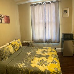 Single Full Size Bed with Shared Hallway Bathroom