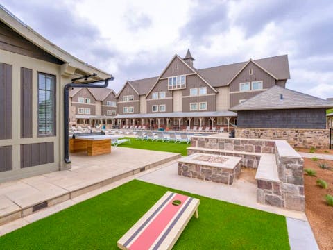 The-Collective-at-Lubbock-Off-Campus-Cottage-Apartments-Near-Texas-Tech-TTU-Resident-Pool-Outdoor-Games-Ping-Pong-Cornhole-Boards-Fire-Pit-1000x667